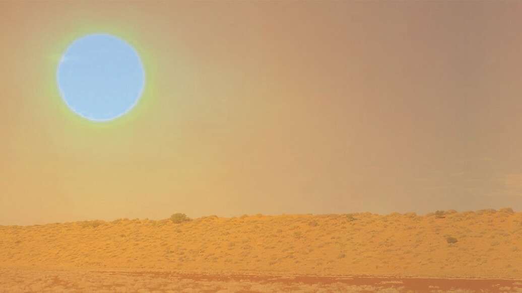 Orange sun over desert